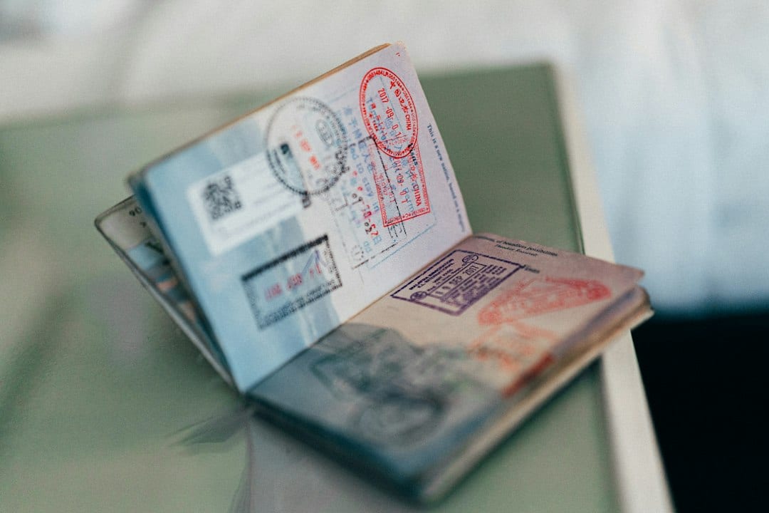 Passport with visa stamps representing successful work visa approvals