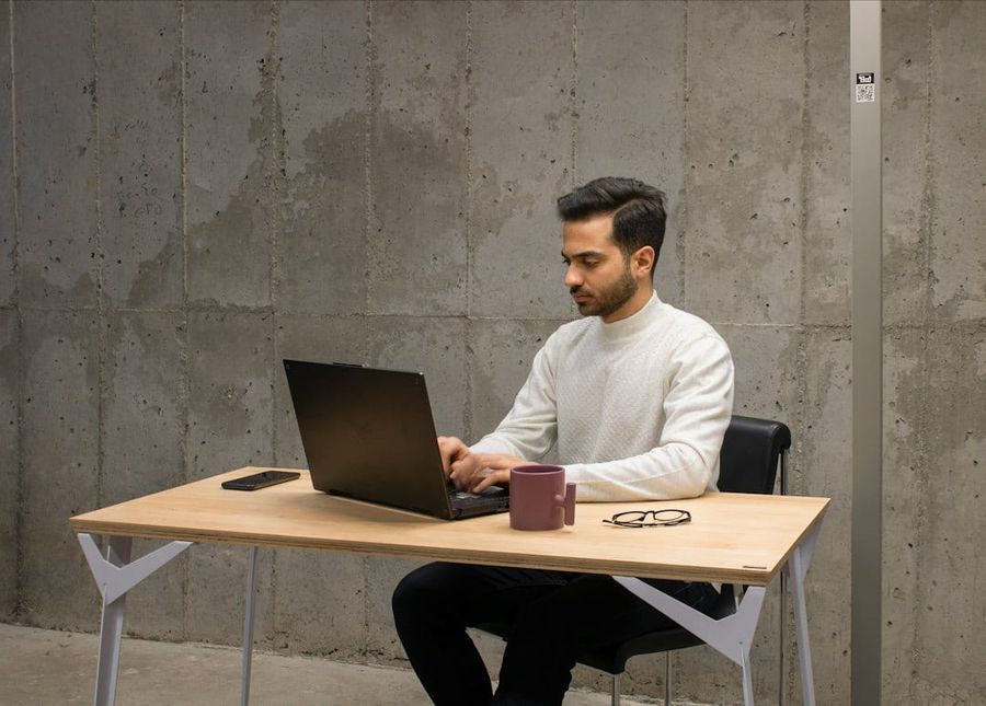 Young professional man working in modern tech office